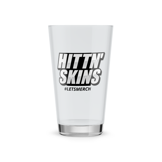 a pint glass with hittn skins logo