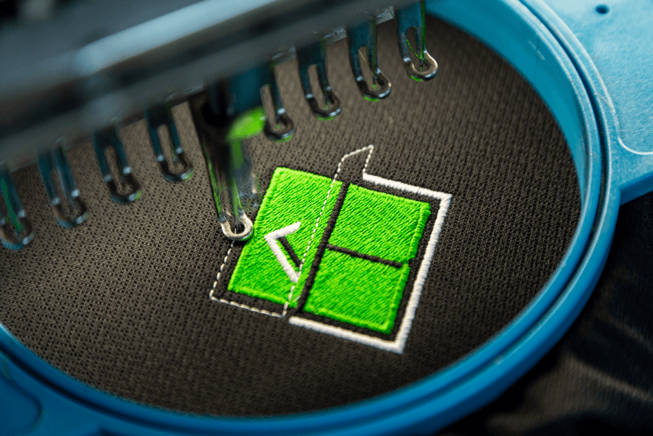 Close Up on Company Logo Being Embroidered